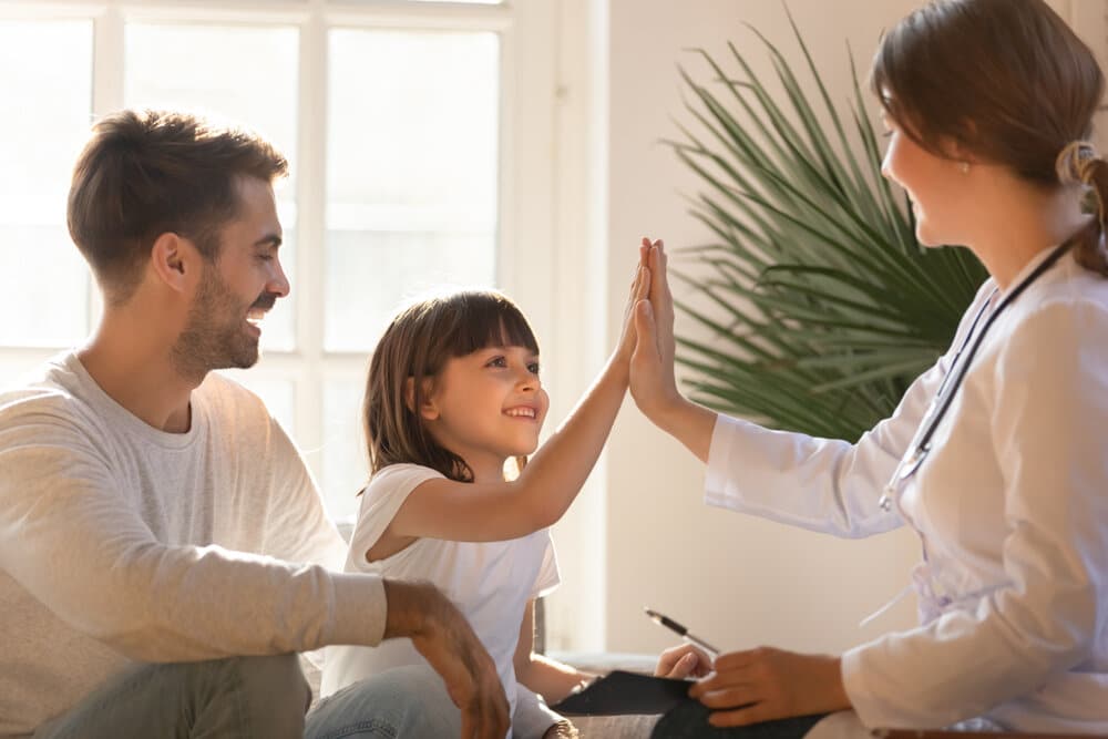 Healthy happy child girl giving high five
